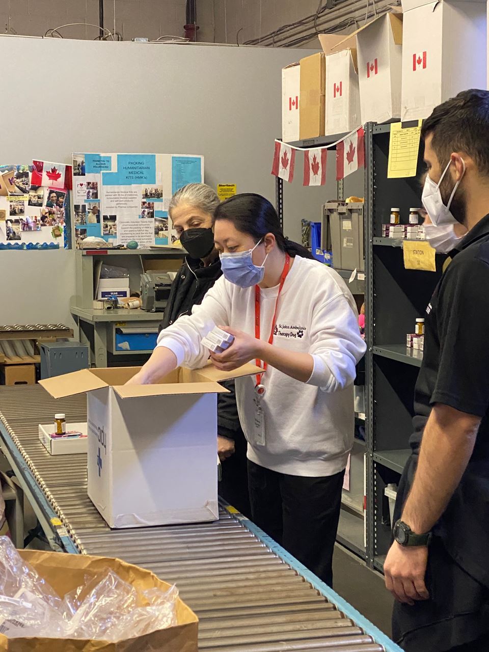 Group of volunteers from St. John Ambulance packing Humanitarian Medical Kits bound for Ukraine, dated April 2, 2022 at HPIC Oakville Distribution Centre. (Source: HPIC)